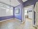Bright dining room with tiled floors and view into kitchen at 154 W End St, Chester, SC 29706