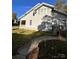 Side view of two-story home with yard and walkway at 154 W End St, Chester, SC 29706