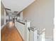 Upper hallway with hardwood floors and white railing at 154 W End St, Chester, SC 29706