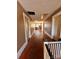 Long hallway with hardwood floors and multiple doors at 154 W End St, Chester, SC 29706