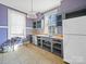 Rustic kitchen with grey cabinets and white appliances at 154 W End St, Chester, SC 29706