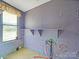 Laundry area with window, shelving and plumbing at 154 W End St, Chester, SC 29706