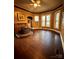 Living room featuring hardwood floors, fireplace and large windows at 154 W End St, Chester, SC 29706