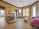 Living room with hardwood floors, fireplace and vintage sofa at 154 W End St, Chester, SC 29706