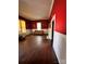 Spacious living room with red walls, hardwood floors and a fireplace at 154 W End St, Chester, SC 29706
