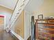 Wooden staircase and antique dresser in hallway at 154 W End St, Chester, SC 29706