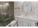 Bright bathroom featuring glass-enclosed shower with gold hardware and white vanity at 407 Crepe Myrtle Ln, Weddington, NC 28104