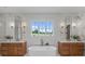 Elegant bathroom featuring a soaking tub, double vanities, and modern fixtures at 407 Crepe Myrtle Ln, Weddington, NC 28104