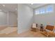 Cozy seating area featuring hardwood floors and natural light at 407 Crepe Myrtle Ln, Weddington, NC 28104