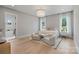 Serene main bedroom with ample natural light, neutral tones, and access to the bathroom at 407 Crepe Myrtle Ln, Weddington, NC 28104