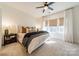 Bright bedroom with a large window, neutral tones, and modern décor at 544 Billingsley Rd, Charlotte, NC 28211