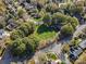 Overhead view of community playground and park, surrounded by mature trees and sidewalks at 8225 Ballymore Ct, Huntersville, NC 28078