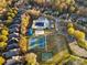 Aerial view of community amenities featuring tennis courts, a pool, and parking at 8225 Ballymore Ct, Huntersville, NC 28078