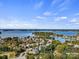 Picturesque aerial view showcasing the lakefront community with lush trees and open water at 8225 Ballymore Ct, Huntersville, NC 28078