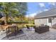 Backyard with a full patio, dining area, seating area, and fenced yard at 8225 Ballymore Ct, Huntersville, NC 28078