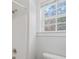 Corner of bathroom featuring the shower head, white shower, and toilet at 8225 Ballymore Ct, Huntersville, NC 28078