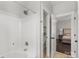 Bathroom featuring white shower and a doorway to the main bedroom at 8225 Ballymore Ct, Huntersville, NC 28078