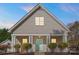 Charming home featuring light gray siding, a stylish front door, and white columns at 8225 Ballymore Ct, Huntersville, NC 28078