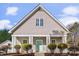 Charming home featuring light gray siding, a stylish front door, and white columns at 8225 Ballymore Ct, Huntersville, NC 28078