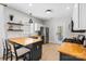 Well-lit kitchen with stainless steel appliances, butcher block countertops, and an island at 8225 Ballymore Ct, Huntersville, NC 28078
