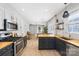 Modern kitchen with stainless steel appliances and butcher block countertops at 8225 Ballymore Ct, Huntersville, NC 28078