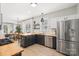 Bright open kitchen with stainless steel appliances and butcher block countertops at 8225 Ballymore Ct, Huntersville, NC 28078
