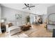 Inviting living room with a comfortable sectional, stylish decor, and ample natural light at 8225 Ballymore Ct, Huntersville, NC 28078