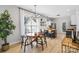 Spacious living area with an adjacent dining area and modern light fixtures at 8225 Ballymore Ct, Huntersville, NC 28078
