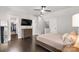 Bright and spacious main bedroom with hardwood floors, walk-in closet, and neutral walls at 8225 Ballymore Ct, Huntersville, NC 28078