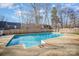 Large backyard swimming pool with ladder and diving board at 1047 Mallard Dr, Rock Hill, SC 29732