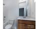 Clean bathroom with single vanity and a toilet at 2212 Noble Townes Way, Charlotte, NC 28262