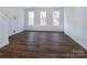 Spacious bedroom with hardwood floors and large windows at 2212 Noble Townes Way, Charlotte, NC 28262