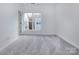 Simple bedroom with gray carpet and a window at 2212 Noble Townes Way, Charlotte, NC 28262