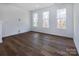 Bright bonus room with hardwood floors and large windows at 2212 Noble Townes Way, Charlotte, NC 28262