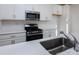 Stainless steel sink and range in a modern kitchen at 2212 Noble Townes Way, Charlotte, NC 28262