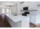 Modern kitchen with white cabinets and quartz countertops at 2212 Noble Townes Way, Charlotte, NC 28262