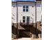 Townhome back view showcasing balcony and private entrance at 2212 Noble Townes Way, Charlotte, NC 28262