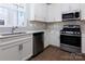 Modern kitchen with stainless steel appliances and white cabinets at 2220 Noble Townes Way, Charlotte, NC 28262