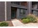 Modern home's exterior with a teal front door and brick facade at 2535 Irwin Stream Rd, Charlotte, NC 28208