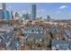 A captivating aerial view of 525 N. Graham St. #3A with the city skyline in the background at 525 N Graham St # 3A, Charlotte, NC 28202