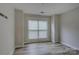 Bright bedroom with wood floors, neutral walls, and large window offering plenty of natural light at 525 N Graham St # 3A, Charlotte, NC 28202