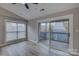 Cozy bedroom with bright window, sliding glass doors to a balcony and modern flooring at 525 N Graham St # 3A, Charlotte, NC 28202