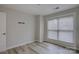 Bright bedroom with wood floors, neutral walls, and large window offering plenty of natural light at 525 N Graham St # 3A, Charlotte, NC 28202