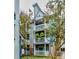 Multi-story building with balconies and beautiful landscaping surrounding the building at 525 N Graham St # 3A, Charlotte, NC 28202