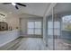 Bright living room featuring modern decor, sleek flooring, and sliding glass doors to a balcony at 525 N Graham St # 3A, Charlotte, NC 28202