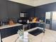 Modern kitchen with dark cabinetry and island at 909 E 7Th St # 241, Charlotte, NC 28204