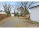 Long backyard view including a garage and home at 27 Sw Barbee Rd, Concord, NC 28027