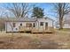 Exterior backyard view including a deck and home at 27 Sw Barbee Rd, Concord, NC 28027