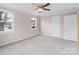 Bedroom with soft carpet, ceiling fan, and freshly painted walls at 27 Sw Barbee Rd, Concord, NC 28027