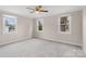 Bright bedroom filled with natural light from the three windows at 27 Sw Barbee Rd, Concord, NC 28027